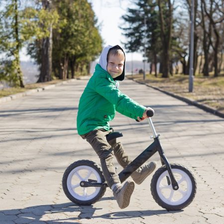 little boy doing tricks riding bike