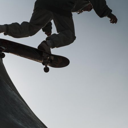 teenager-having-fun-with-skateboard-park-outside